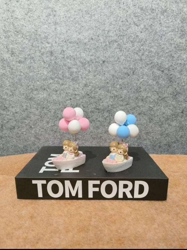 Artifacts Whimsical Balloon Boat Figurines with Couples on Tom Ford Inspired Decor Book